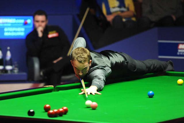 Heat is on: Ali Carter on his way to beating Stephen Maguire at the Crucible