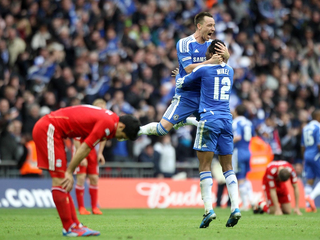 Chelsea captain John Terry and John Obi Mikel embrace in celebration at the final whistle