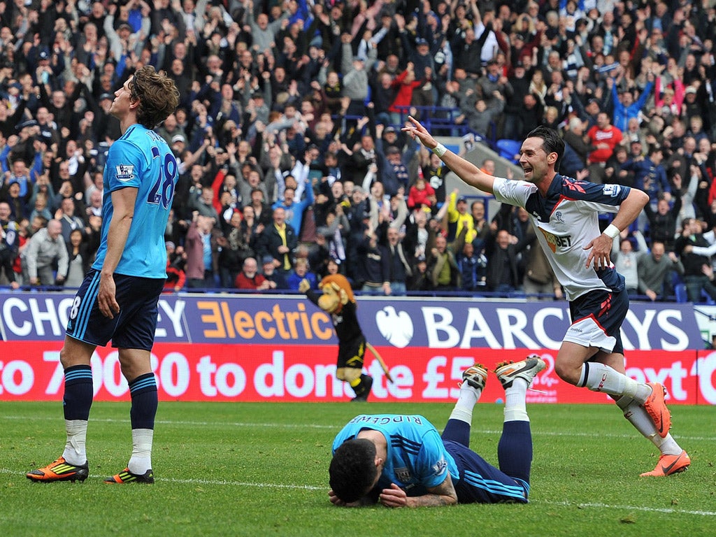 Chris Eagles celebrates Bolton's second goal as Albion's Billy Jones sent the ball into his own net