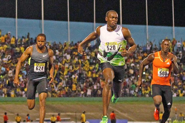 Usain Bolt (left) wins the 100m at the Jamaica Invitational