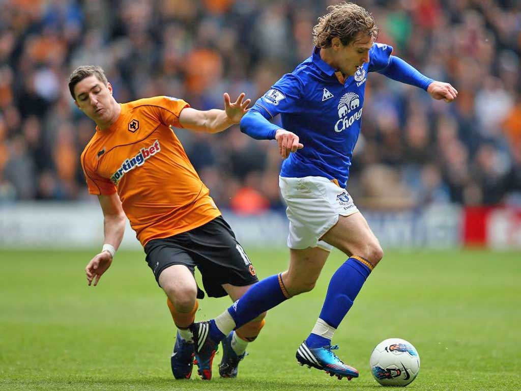 Wolverhampton’s Stephen Ward (left) tangles with Everton’s Nikica Jelavic