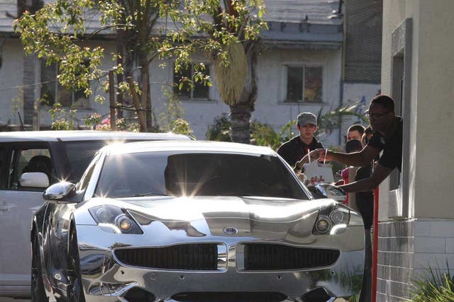 Justin Bieber and Selena Gomez in a brand new Fisker Karma car