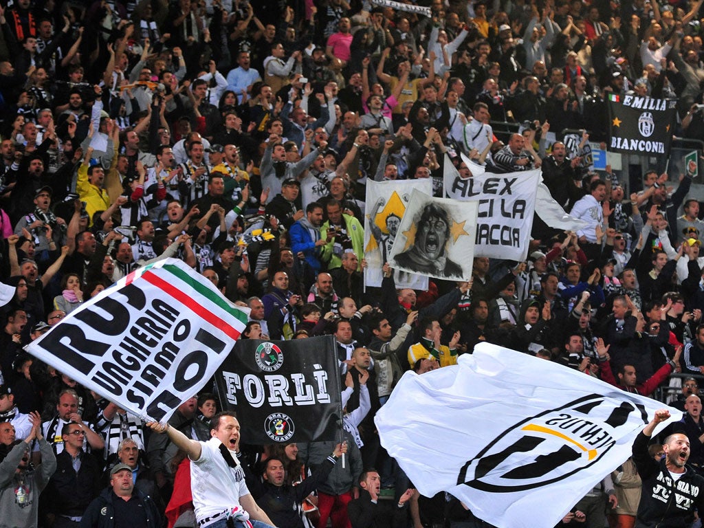 Juventus fans celebrate after winning the title