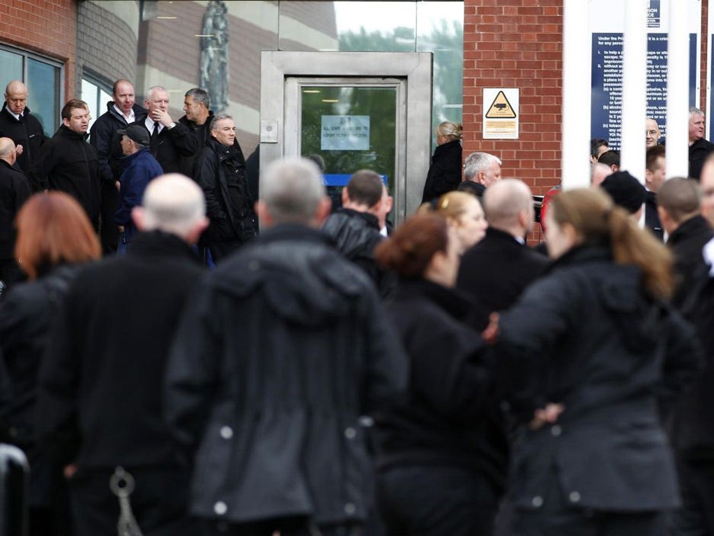 Prison staff take part in a protest outside HMP Manchester, as public sector workers go on strike in a row over pensions