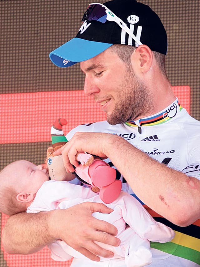 Mark Cavendish holds Delilah Grace after yesterday’s win