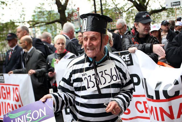 Union activists and public sector workers march through central London in protest at pension reforms