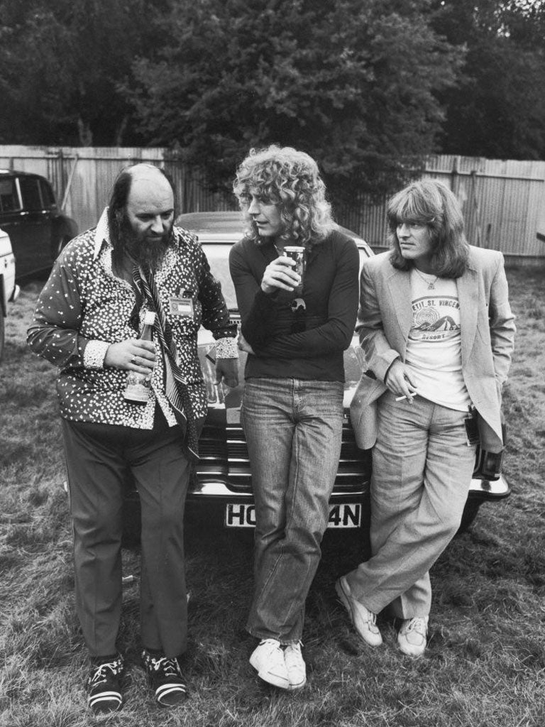 Grant with lead singer Robert Plant and bassist John Paul Jones at Knebworth festival