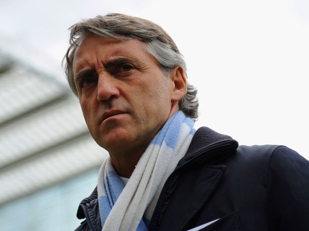 Roberto Mancini replaced Hughes as manager