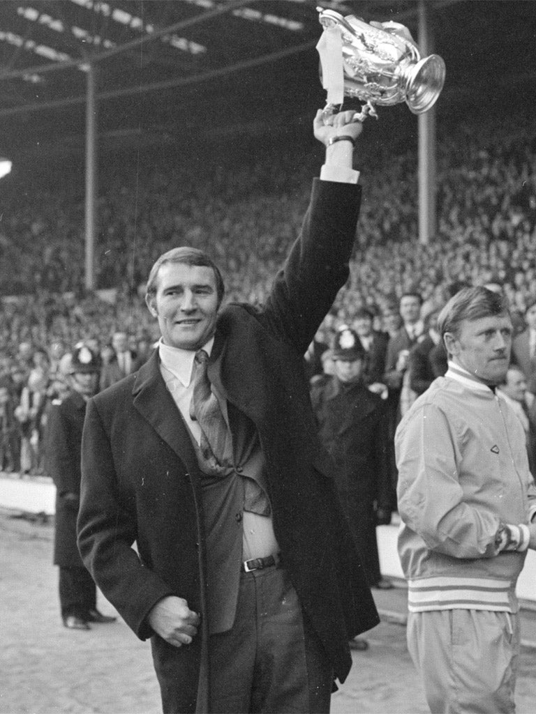 The flamboyant Malcolm Allison holds the League Cup aloft in 1970
