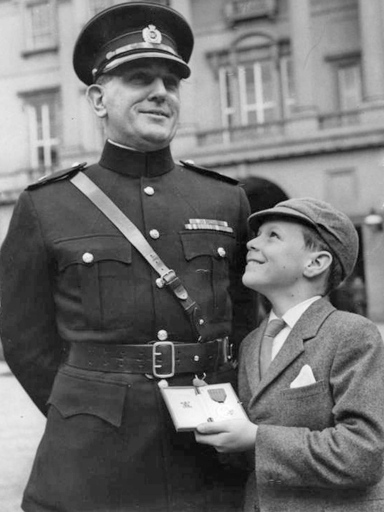 Qualtrough with his son Henry after receiving the George Medal in 1967