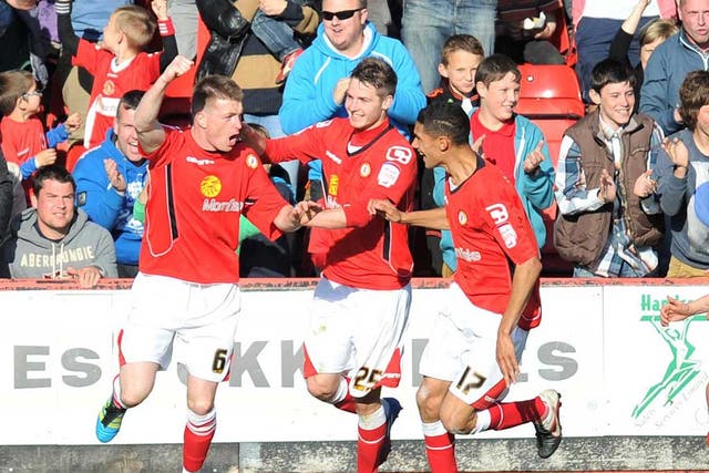Dug deep: Crewe's Adam Dugdale (left) celebrates his goal against Southend