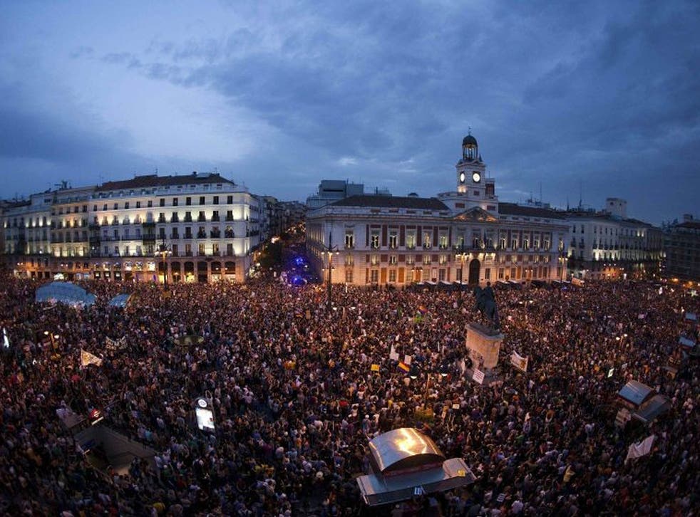 Activists in the Puerta del Sol square during a protest marking the one year anniversary of Spain's Indignados  movement in Madrid