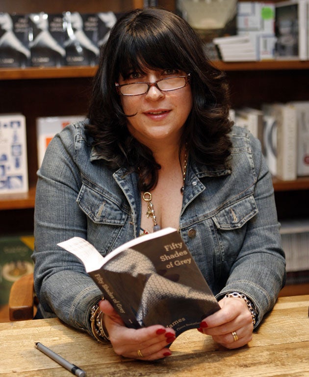 Text in the city: the author EL James with a copy of ‘Fifty Shades of Grey’