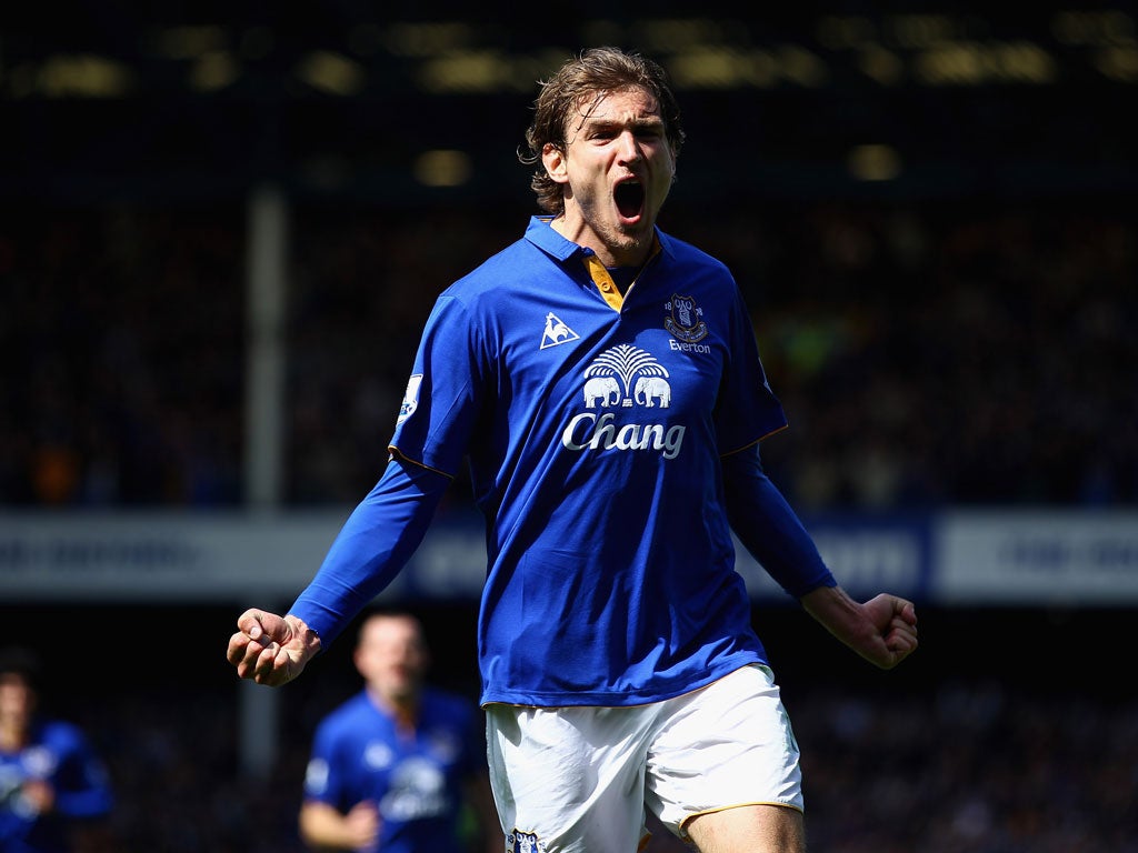 Nikica Jelavic celebrates after netting his side's second goal against Newcastle