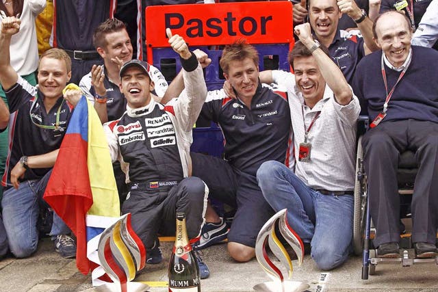 Pastor Maldonado (left)and Sir Frank (right) celebrate Williams’ first
grand prix win since 2004