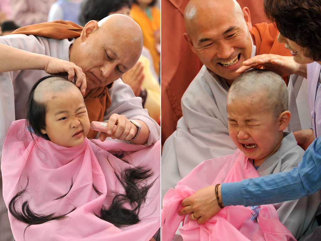 South Korean boys get their heads shaved by Buddhist monks