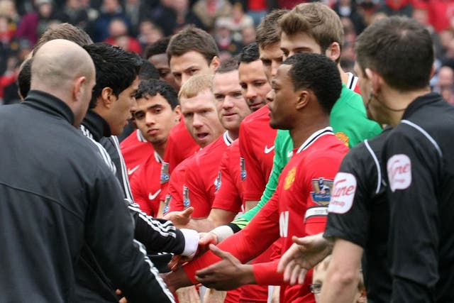 <b>Take it as red</b><br/>
The eyes of the world – certainly the United players – were on Luis Suarez as he opted to refuse to shake Patrice Evra’s hand.
