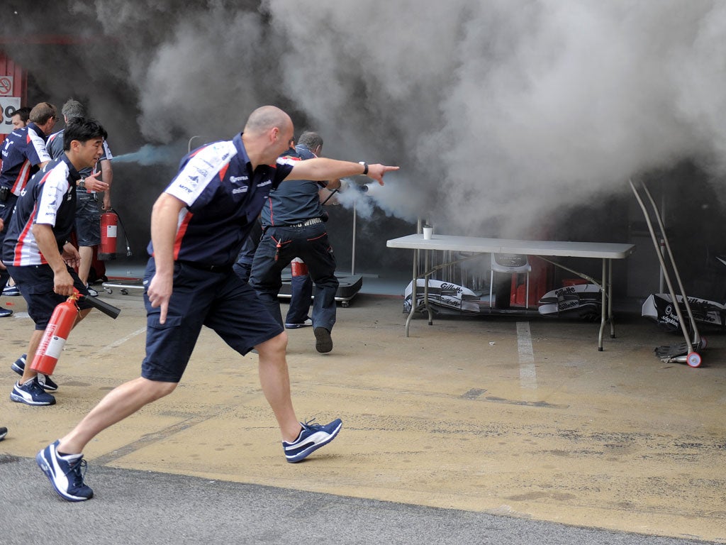The fire is tackled in the Williams garage
