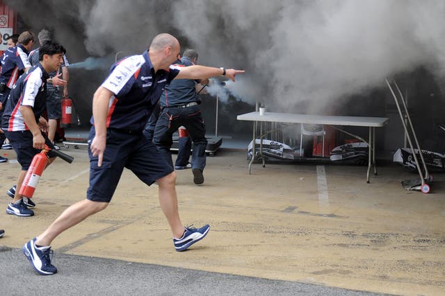 The fire is tackled in the Williams garage