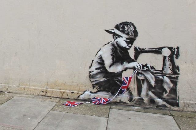 This work by Banksy, which appeared on a street in Wood Green last May, has been ripped out and will be auctioned in Miami