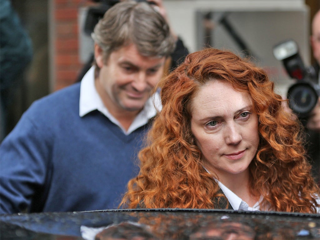 Rebekah Brooks, former CEO of News International, outside her lawyers' London office after being charged with conspiracy to pervert the course of justice in connection with the hacking scandal