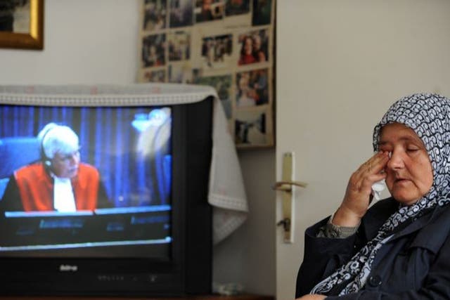 Ramiza Gurdic, 59, who lost her husband and two sons in
Srebrenica, watches the trial in Sarajevo