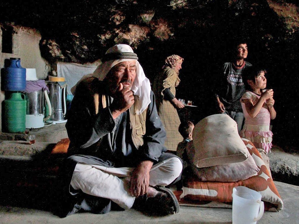 Hamid Jabareen and his family in the cave which
is their home in the village of Jenba