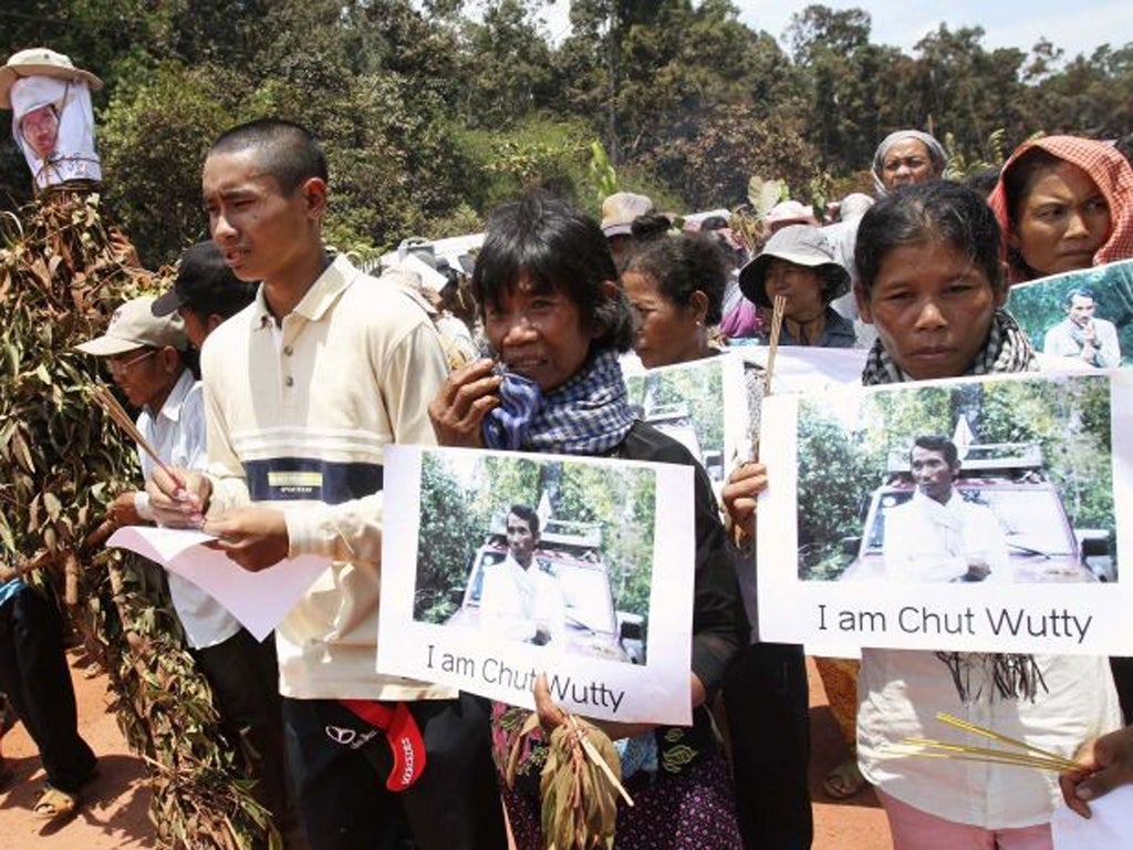 Protesters march to the spot where the activist Chut Wutty was shot dead last month