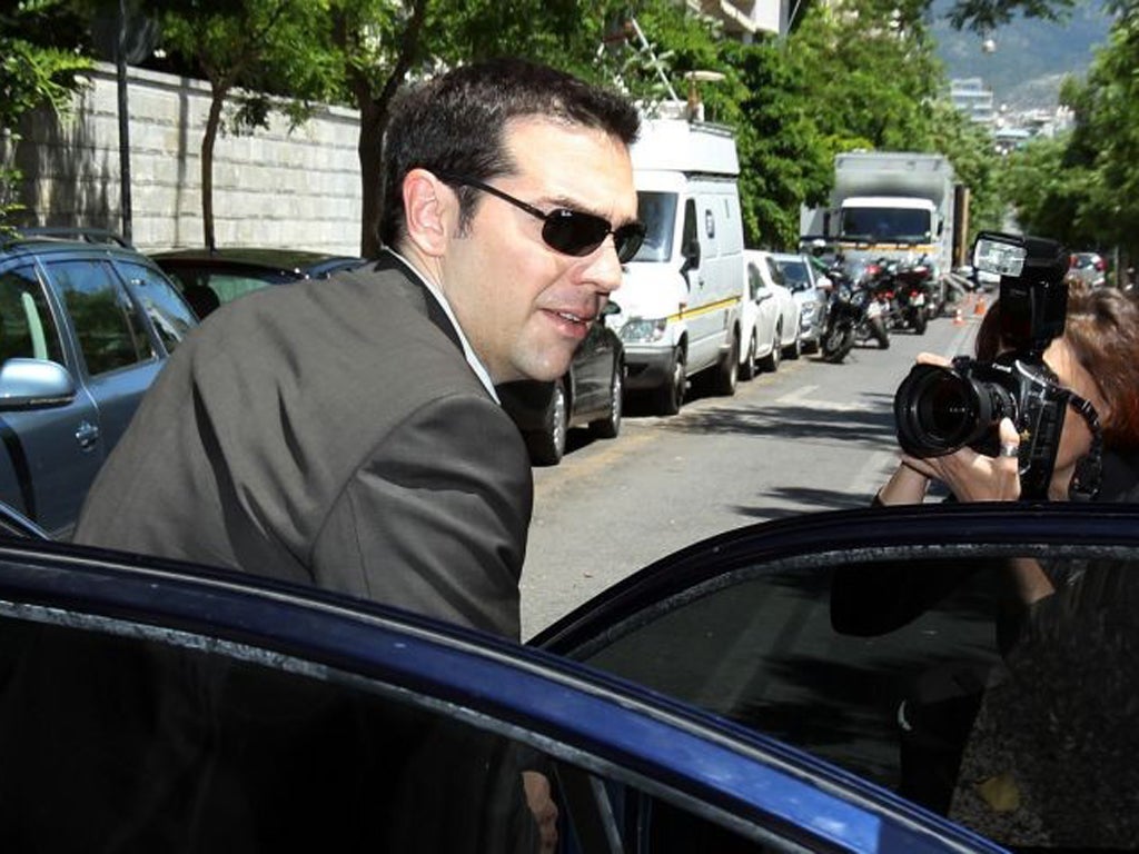 Leader of the Radical Left party Alexis Tsipras in Athens yesterday after meeting the President