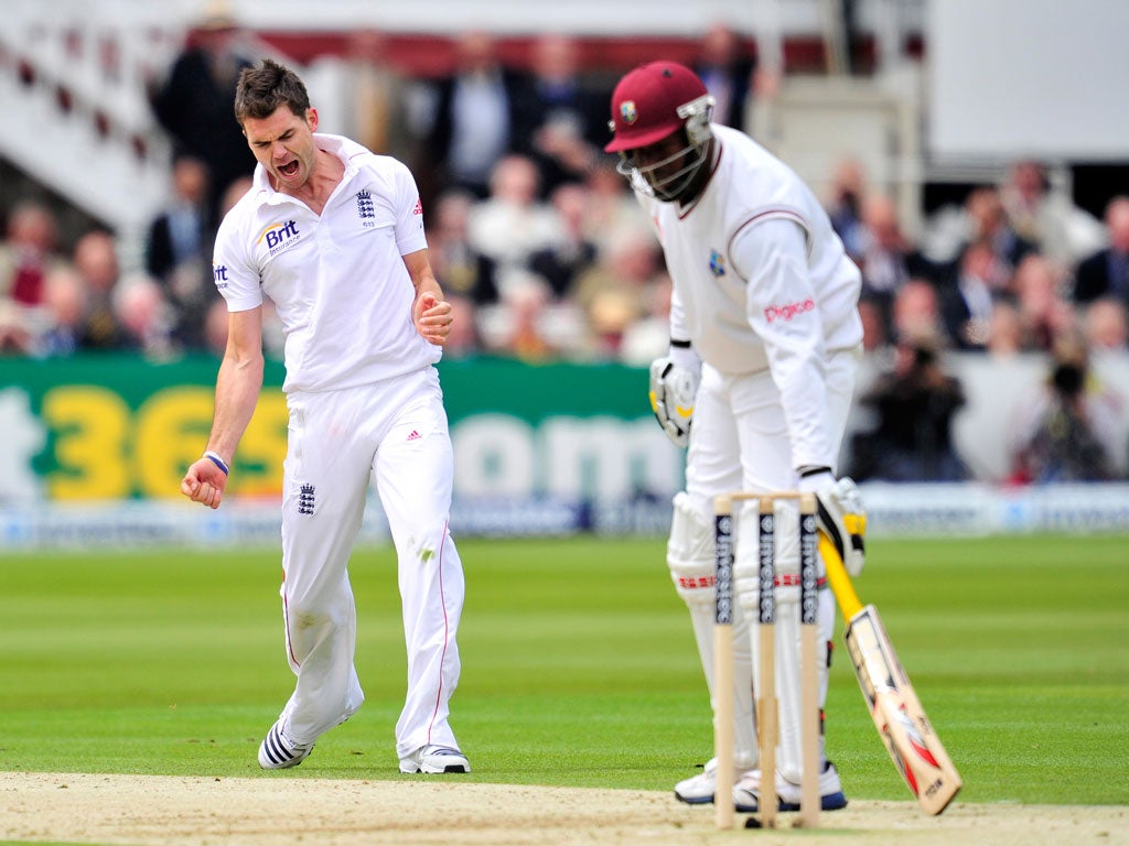 England cricketer James Anderson (left) celebrates taking the wicket of West Indies' Kirk Edwards