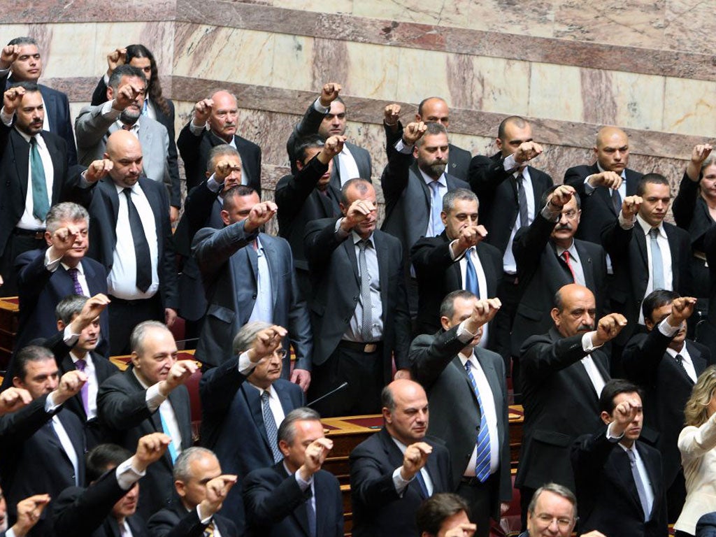 Members of the Golden Dawn party are sworn in during the ceremony at the Greek parliament in Athens today