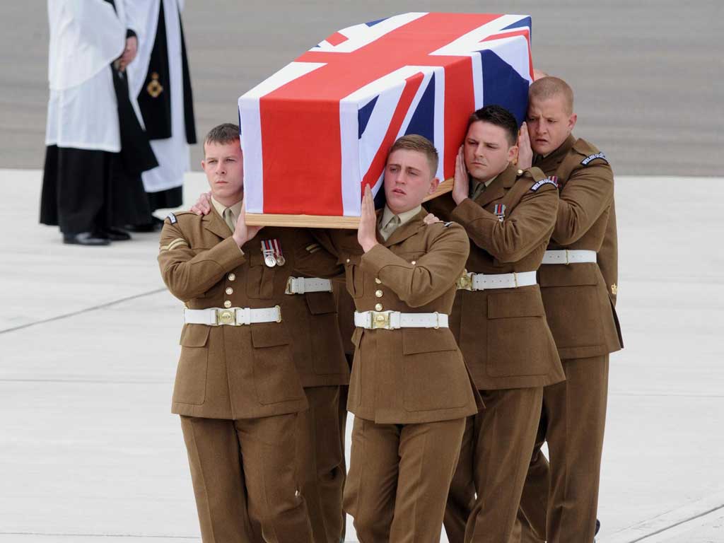 A coffin containing the body of L/Cpl Lee Davies at RAF Brize Norton yesterday