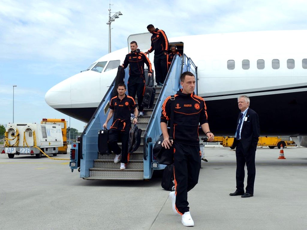 Chelsea's players, led by the suspended John Terry, disembark from the plane yesterday in Munich ahead of tonight's European Cup final