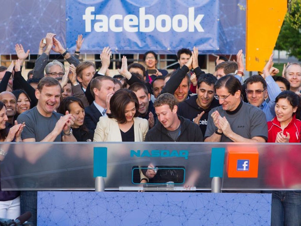 The Facebook founder, Mark Zuckerberg, rings the Nasdaq
exchange opening bell remotely from California to signal the launch
of Facebook's flotation