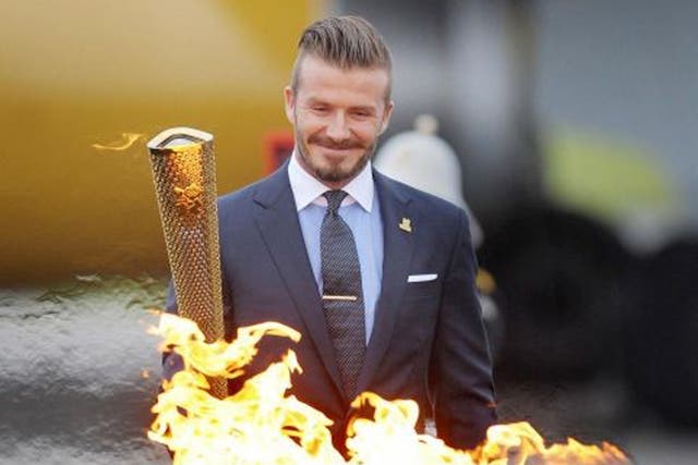 David Beckham lights the Olympic Torch