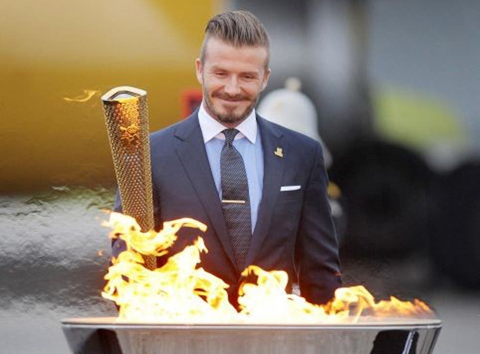 David Beckham lights the Olympic Torch