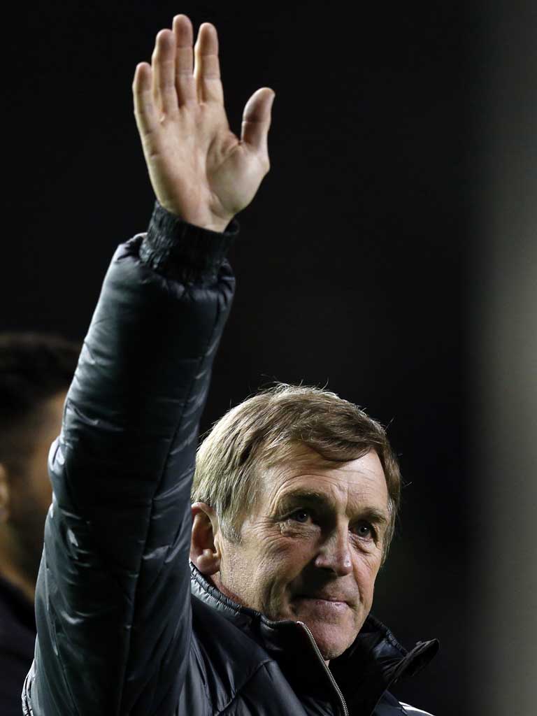 Waving, then drowning: Kenny Dalglish salutes Liverpool supporters at Anfield during his second, recently terminated spell as manager of the club
