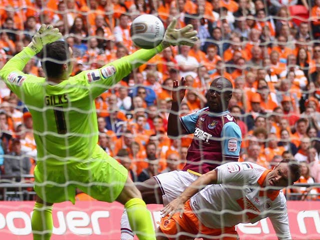 Cole finish: Carlton Cole's well-taken goal puts West Ham a goal up against Blackpool yesterday