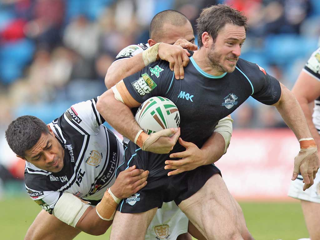 Chris Bailey, of London Broncos, is shackled by the Hull defence