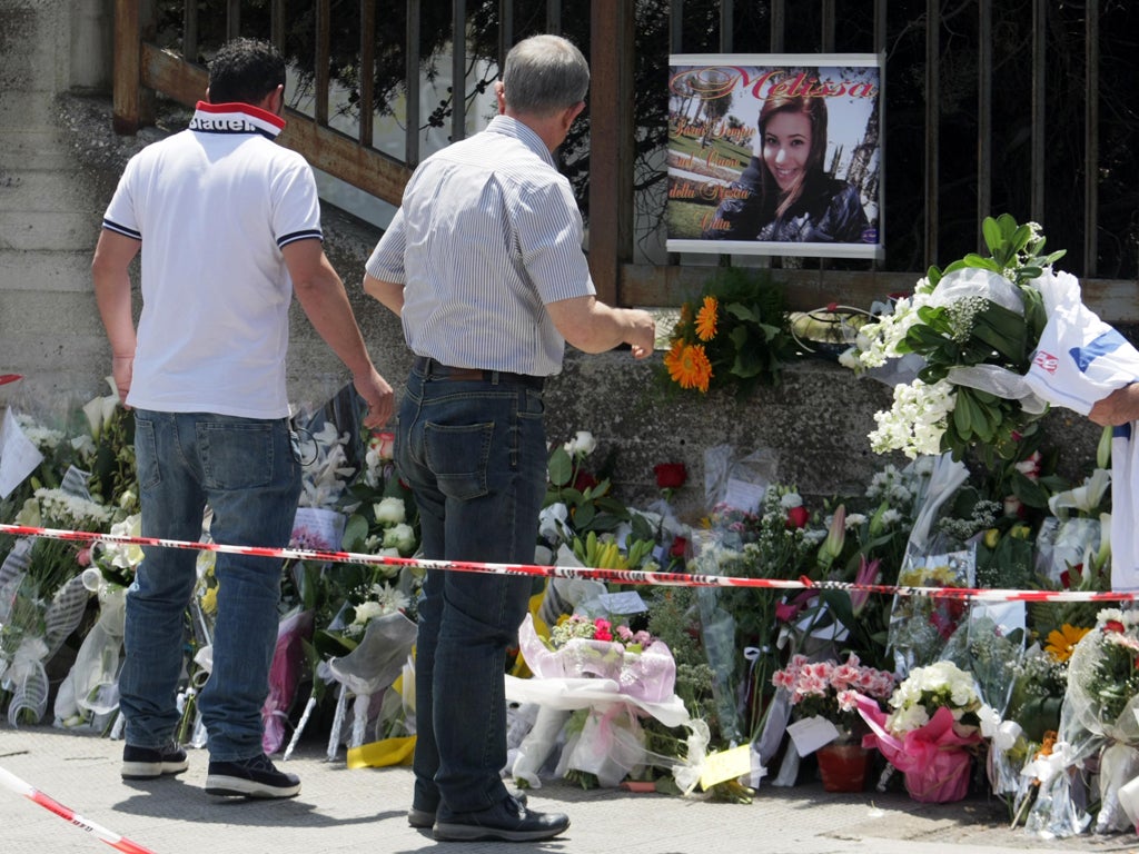 Flowers have been left in memory of the girl who was killed in a bomb attack in Italy