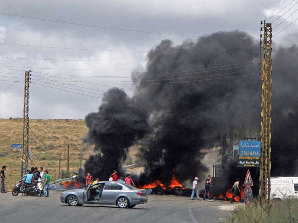 Roads near the town of Halba were blocked by blazing tyres yesterday