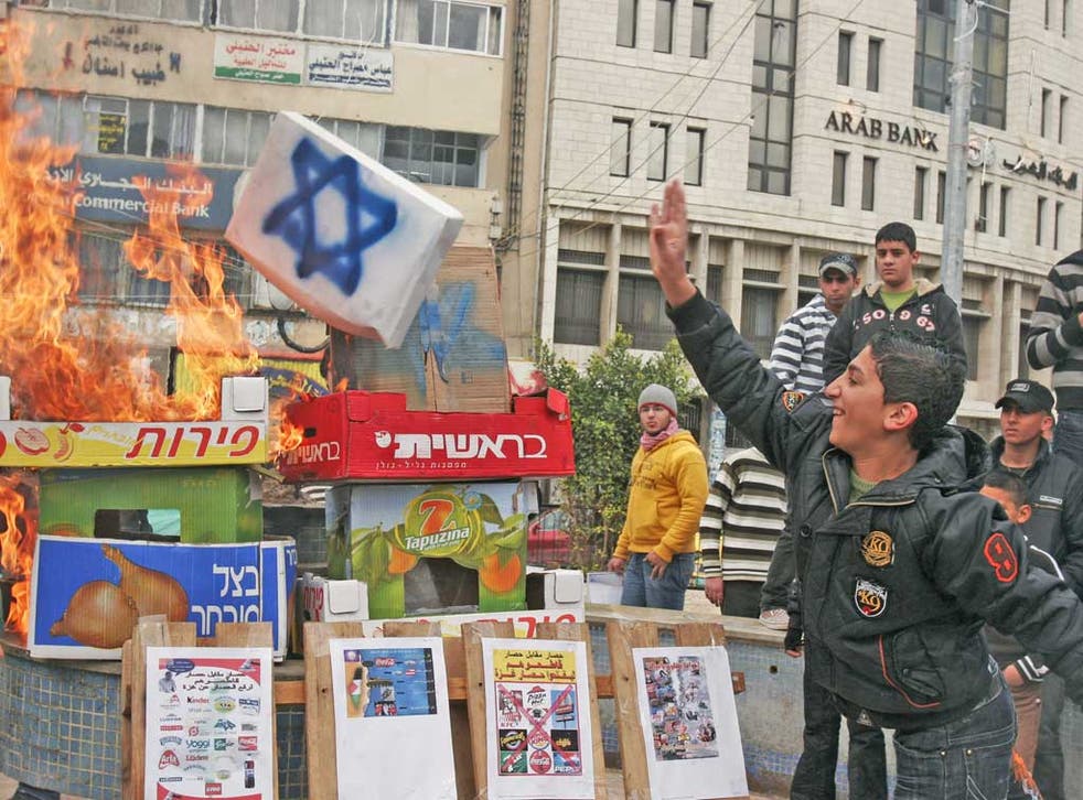 Palestinians burn boxes of Israeli produce. Now The Palestinian boycott of goods from Jewish settlements has received a boost from South Africa