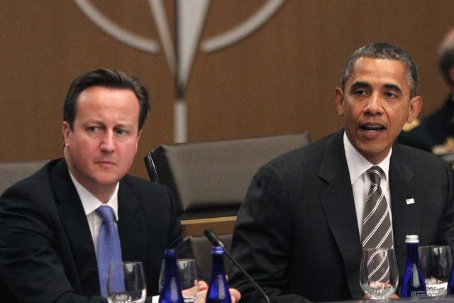 David Cameron listens as Barack Obama speaks at the Nato summit today