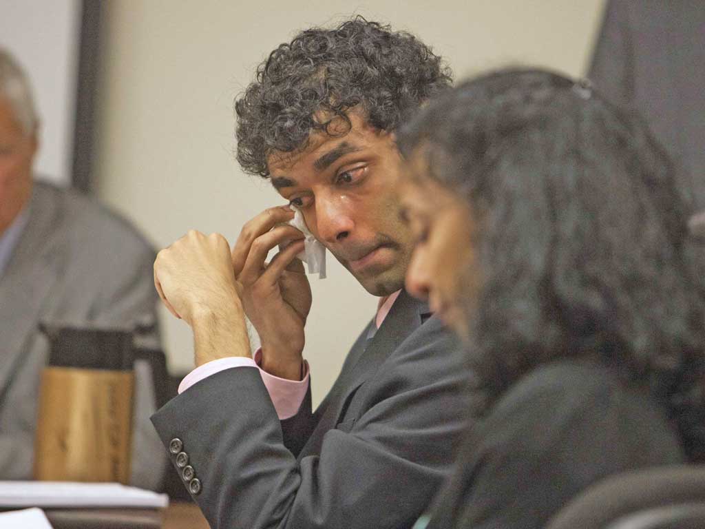 Dharun Ravi wipes a tear from his eye as his mother, Sabitha Rav reads a statement during a sentencing hearing for his conviction in using a webcam to invade privacy