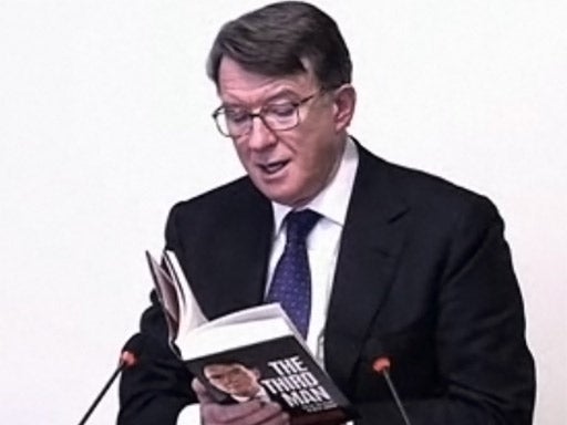 Lord Mandelson at the Leveson Inquriry with his own book, 'The Third Man'