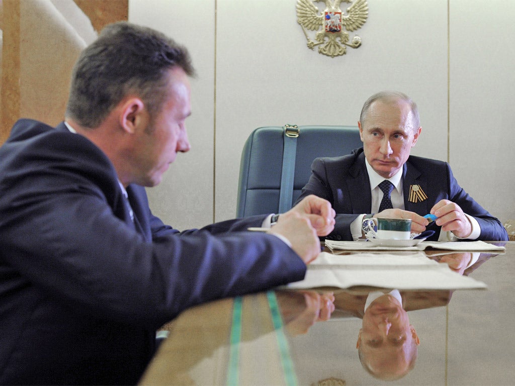 Vladimir Putin, right, and Igor Kholmanskikh, pictured during a meeting earlier this month