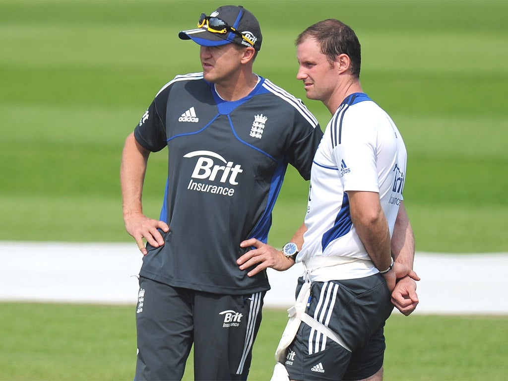 Andrew Strauss (right) talks tactics with England coach Andy Flower during practice at Trent Bridge