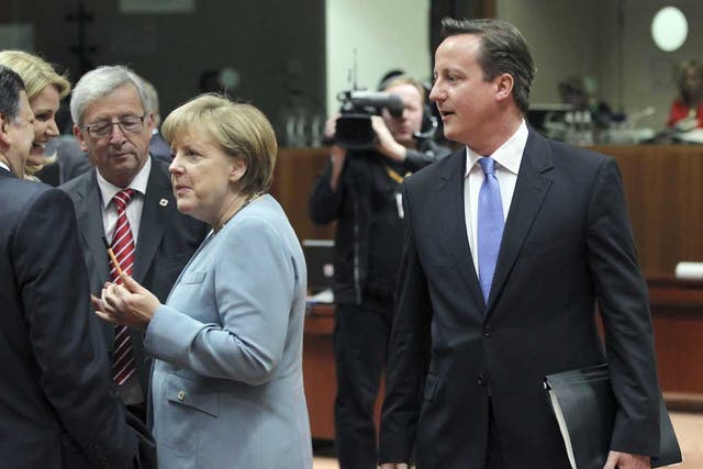David Cameron walks past Jose Manuel Barroso, Helle Thorning-Schmidt, Jean-Claude Juncker and Angela Merkel during at last night's summit in Brussels