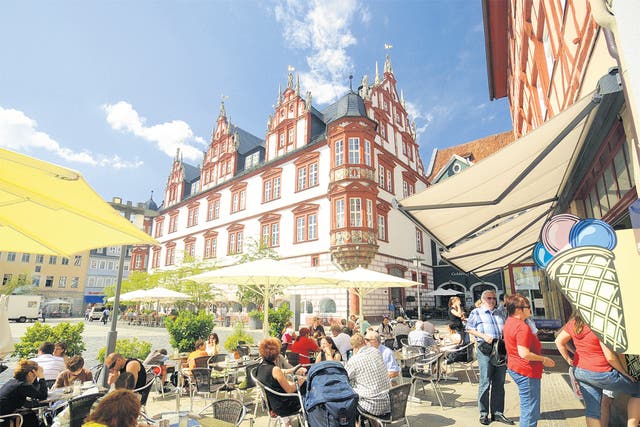Market square cafés like this one are popular meeting places for students in Coburg, Bavaria