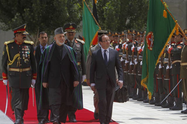 The French president François Hollande (right) with Afghan President Hamid Karzai